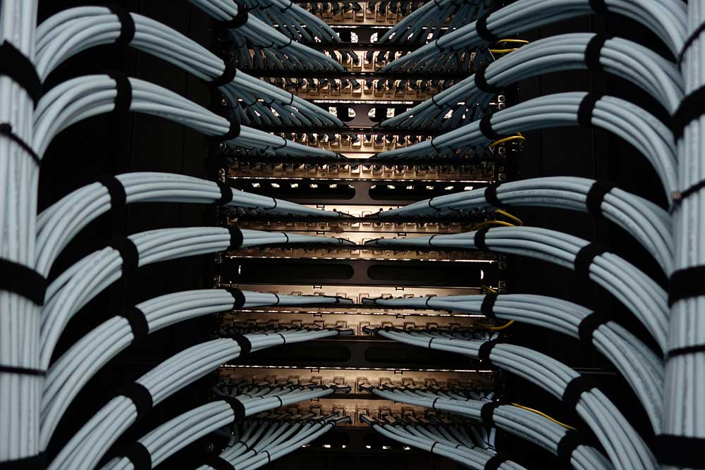 Yellow and red ethernet cable that sits in a box